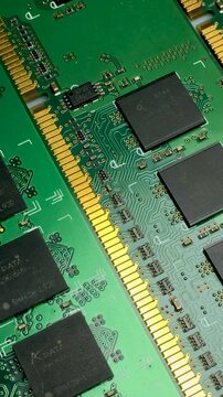 Electronic printed circuit boards with memory chips close-up. Vertical video