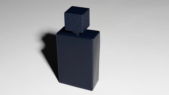 Black rectangular object with small cube on top casting a shadow