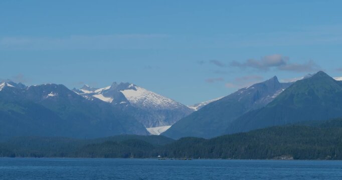 Sunny day in Juneau, Alaska.Mendenhall Glacier and the surrounding mountains in the background.