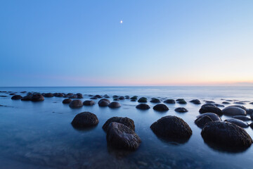 Mystical sunset over unique rock spheres at Bowling Ball Beach, California © Sumiko Scott
