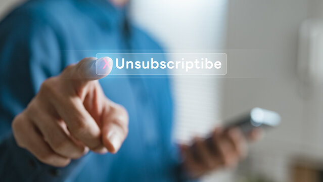 User pressing unsubscribe button on smartphone, representing subscription cancellation, recurring billing control, and account management with digital platform settings and payment termination process