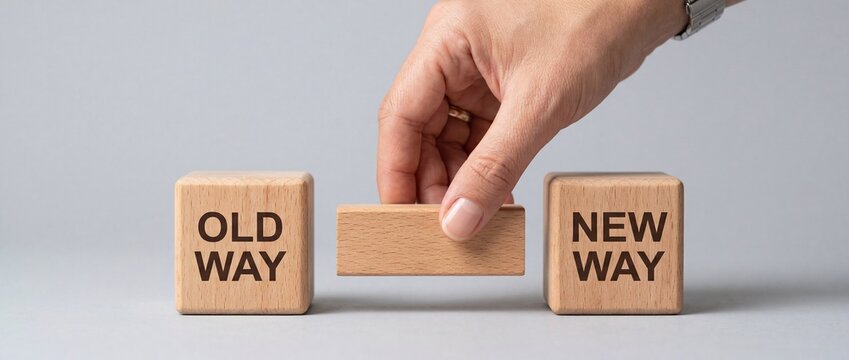 Business transformation concept with hand placing block from old to new way