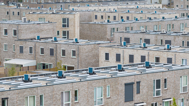 Aerial View of Rooftops with Heat Pumps and Clean Energy