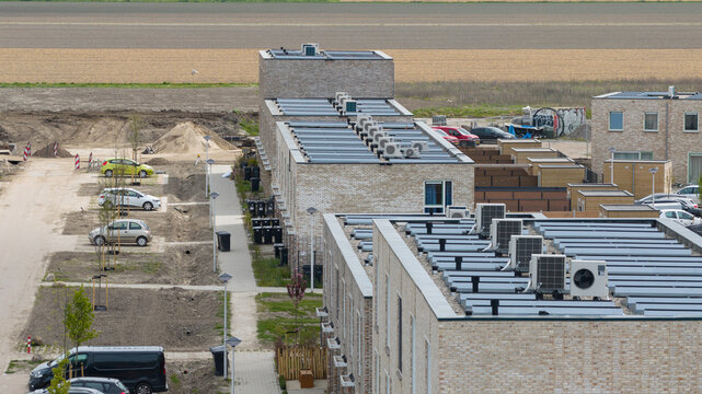 Aerial View of Rooftops with Heat Pumps and Clean Energy
