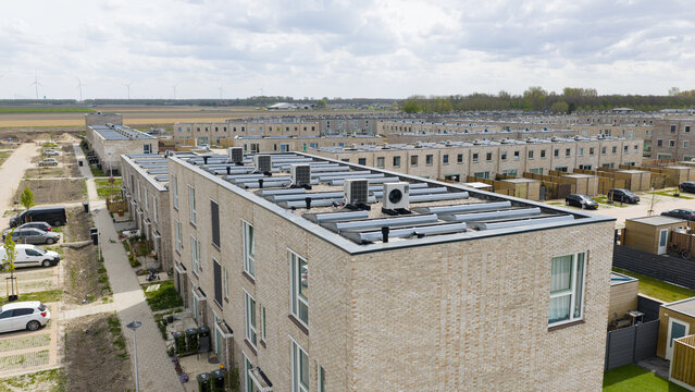 Aerial View of Rooftops with Heat Pumps and Clean Energy