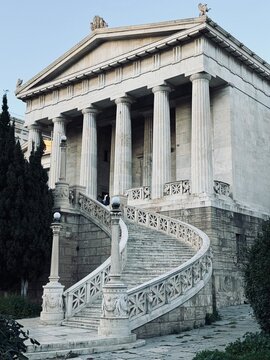 Neoclassical facade of the National Library of Greece in Athens, part of the Athenian Trilogy. Marble columns, grand stairs, symmetry and classical Greek architectural heritage