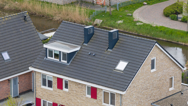 Aerial View of Rooftops with Heat Pumps and Clean Energy