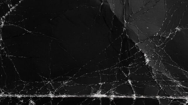 Crumpled black paper sheet seamless texture, recycled paper texture background for copy space, stop motion graphic