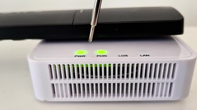 White network modem device with illuminated green power and connection indicator lights, highlighting electronic setup, diagnostic process, and reliable household connectivity