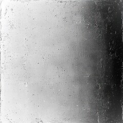 Obraz premium rough textured grayscale wall with soft left-to-right light gradient, moody minimalist atmosphere