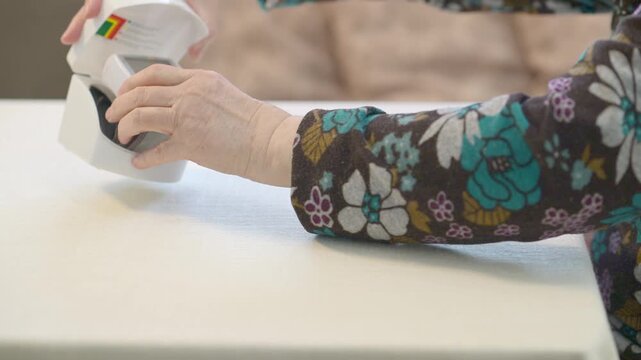 Elderly Woman Measuring Blood Pressure in Morning Routine