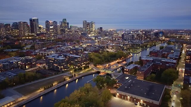 Aerial night skyline of Montreal with Lachine Canal, illuminated bridge, downtown skyscrapers and city lights in Quebec, Canada. g.