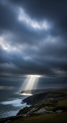 Fototapeta premium Dramatic coastal landscape with sunbeam breaking.
