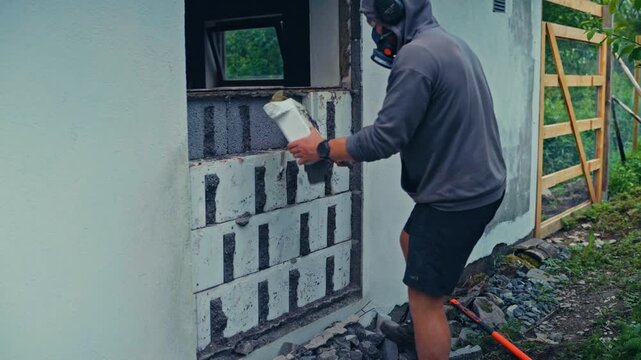 Man Assembling Foam Blocks, Construction Technique Known As Insulated Concrete Forms (ICF)