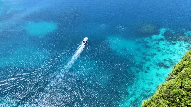 Aerial View of Speed Boat Cruising Past Tropical Rock Islands in Palau
