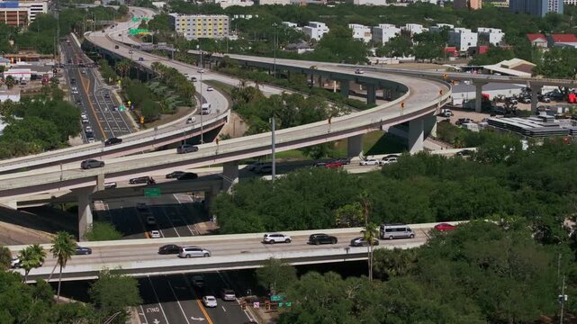 Aerial Establishing Shot of Busy complex Interstate 275 Overpass Exchange During Rush Hour Vehicle Traffic in St Petersburg, Florida on a clear day