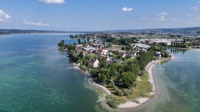 Panorama flight towards church Basilica of Sts. Peter and Paul on island Reichenau over Lake Constance (Bodensee) near Konstanz, Germany