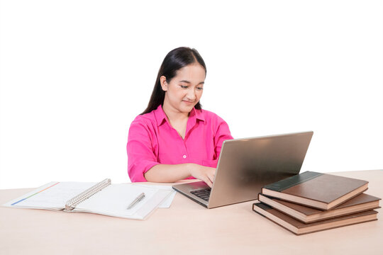 Smiling Asian Female Student in Pink Shirt Studying with Laptop and Books on White Background