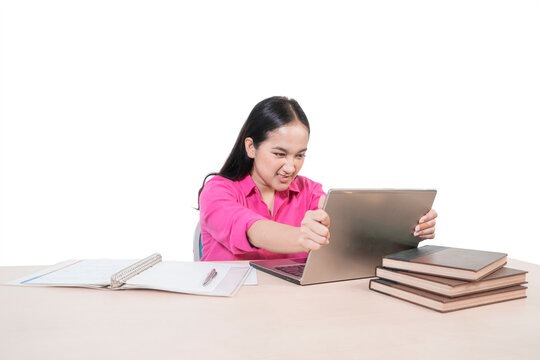 Frustrated Asian Woman in Pink Shirt Angry at Laptop Screen Isolated on White Background