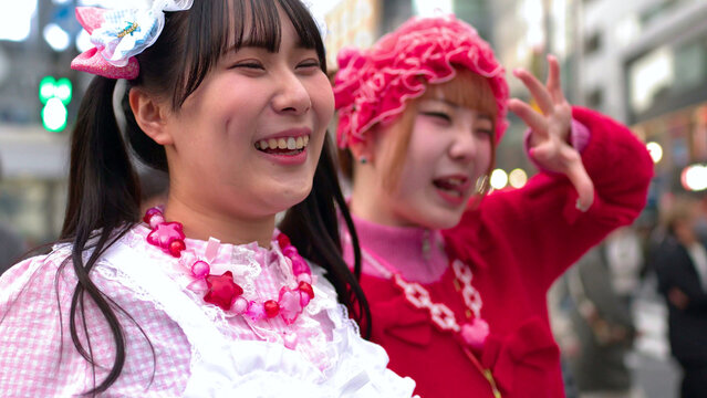 Two Young Women in Colorful Decora Fashion Smiling in Shibuya Tokyo