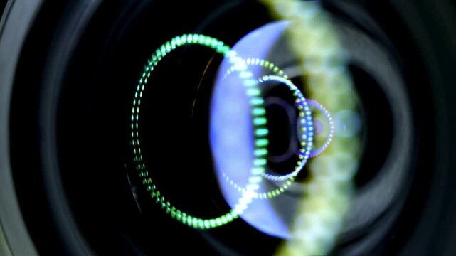 Closeup of Camera Lens animation. Detailed Internal objective lens of a camera. Footage of light swipe through the camera lens. Particle Lens Flare.