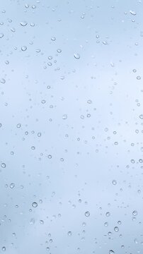 The weather is bad. Raindrops glisten on the windowpane against the backdrop of a gloomy, cold sky. It doesn&rsquo;t feel cozy - Vertical video