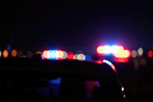 Blurred background of police flashing lights at the crime scene