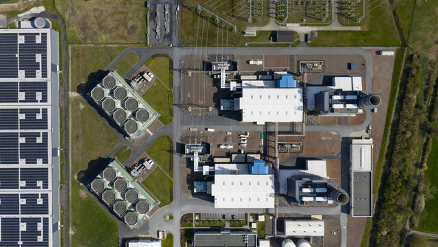 Aerial view of the Trianel Gaskraftwerk Hamm power plant featuring hexagonal cooling units and solar panel arrays in Hamm, Nordrhein-Westfalen, Germany.