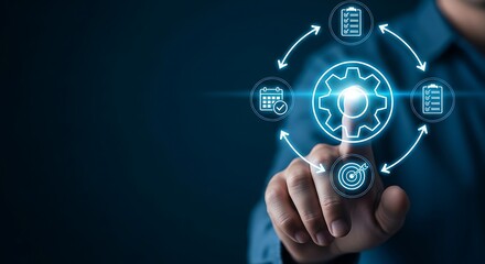 Obraz premium A person interacting with a futuristic digital interface with glowing blue icons and gears