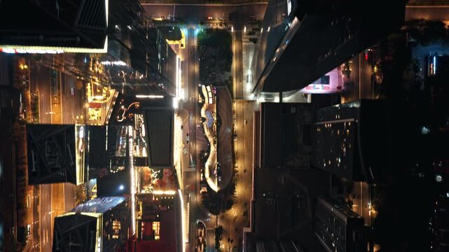 time lapse of traffic in modern city at night, aerial view