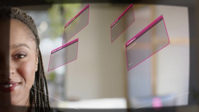 Woman facing left, sweeping cursor causing panels rotating on glass near her, smiling, showing tech