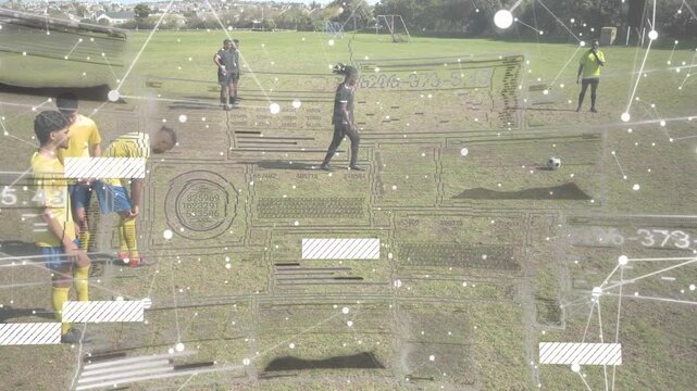 Vertical video: Kicker in dark kit placing ball then striking to score in soccer, HUD tracking