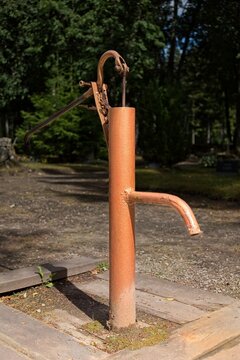 Manual hand-operated water pump, typically used to draw water from a well, Muhu, Estonia, Europe.