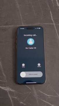 Vertical Screen: A smartphone rests on a table, displaying an incoming call from No Caller ID. The call alerts the user to a hidden caller trying to reach them.