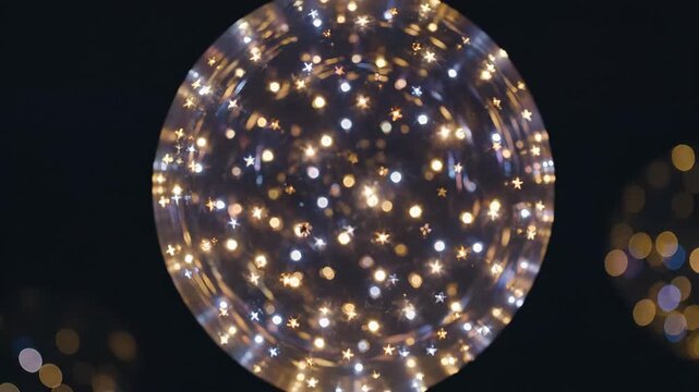 Glowing transparent party balloon with string lights