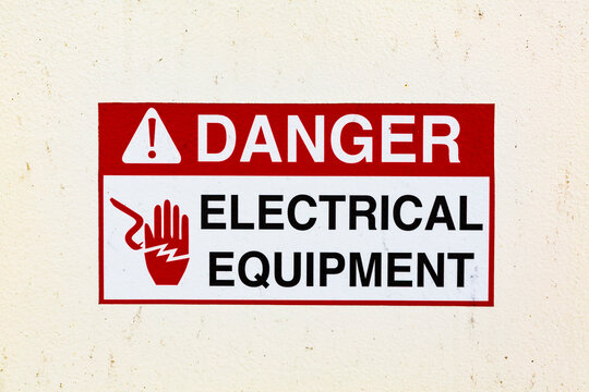 Signs on a ferry warning of electrical equipment, USA
