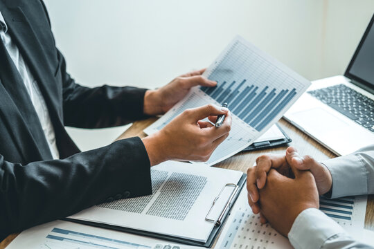 Co-working Business Team Consulting meeting Planning with digital tablet Strategy Analysis investment and saving concept. meeting discussing new plan financial graph data.