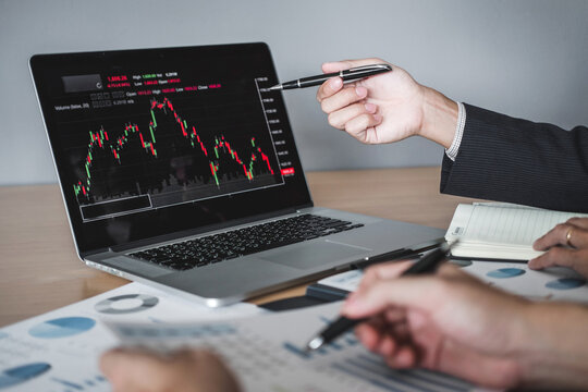 Investment Entrepreneur Trading discussing and analysis graph stock market trading