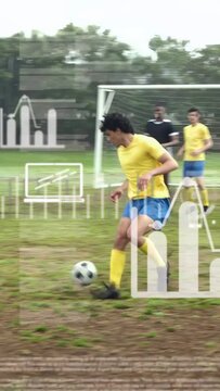 Vertical video: After clearance soccer attacker taking and dribbling to goal while HUD showing shot