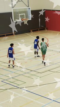 Vertical video: Sports green shooter shooting to score, blue guarding, star overlay tracking ball
