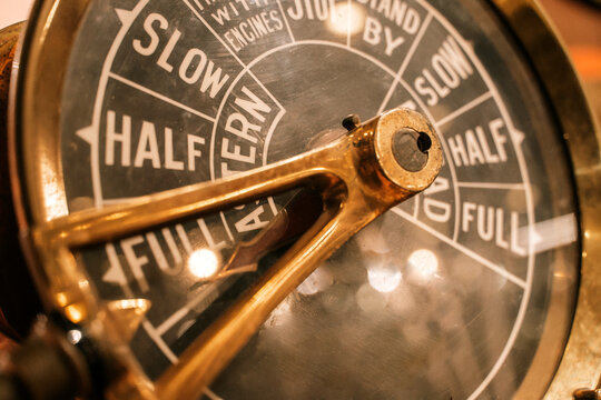 Vintage ship engine telegraph dial close-up, nautical control instrument
