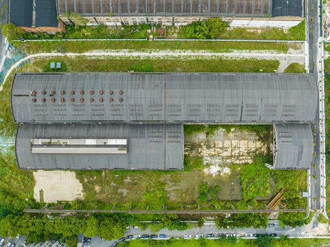 Aerial view of abandoned factory site with overgrown lot in Hangzhou