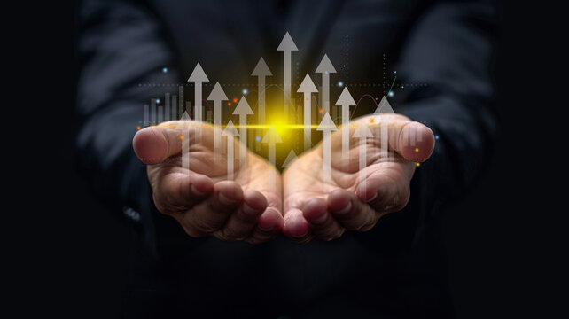 Growth planning and business strategy. Businessman holding financial growth chart increased income. market statistics gain profits.