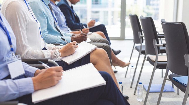 Business professionals attending a corporate conference or seminar.