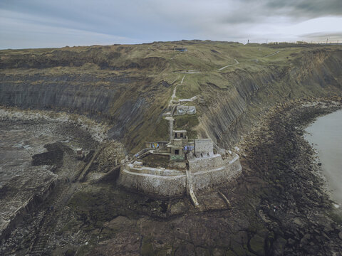 Aerial view of blockhaus stutzpunkt 221 arnika on a rocky cliff overlooking the sea, Pointe de la Creche, Pas-de-Calais, France.