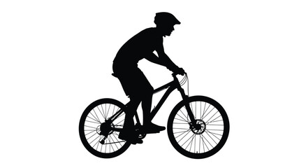 Obraz premium A cyclist riding a mountain bike in a dark striking silhouette