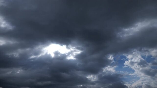 Time-lapse Sky With Clouds Moving With Sun Rays Filtering Through The Clouds