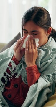 Sick, sneeze and woman in living room with tissue, influenza and cold congestion in allergy season. Health, virus and person in house with paper napkin, blowing nose and viral flu in wellness risk.