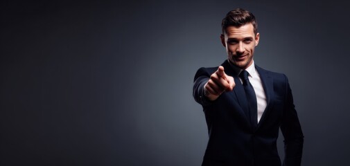 Obraz premium The businessman pointing at the viewer in a confident suit portrait