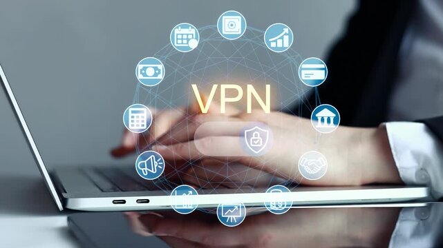 Person using a laptop with VPN icons on the screen in an office setting during the day.